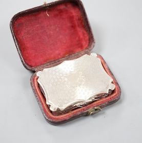 An early Victorian engine turned silver shaped rectangular vinaigrette, by Nathaniel Mills, Birmingham, 1843, 36mm, in leather box.